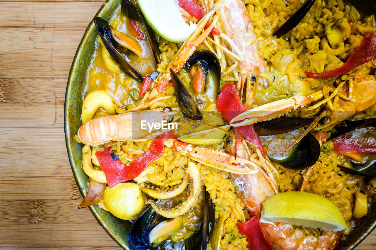 Close-up of seafood in plate on wooden table