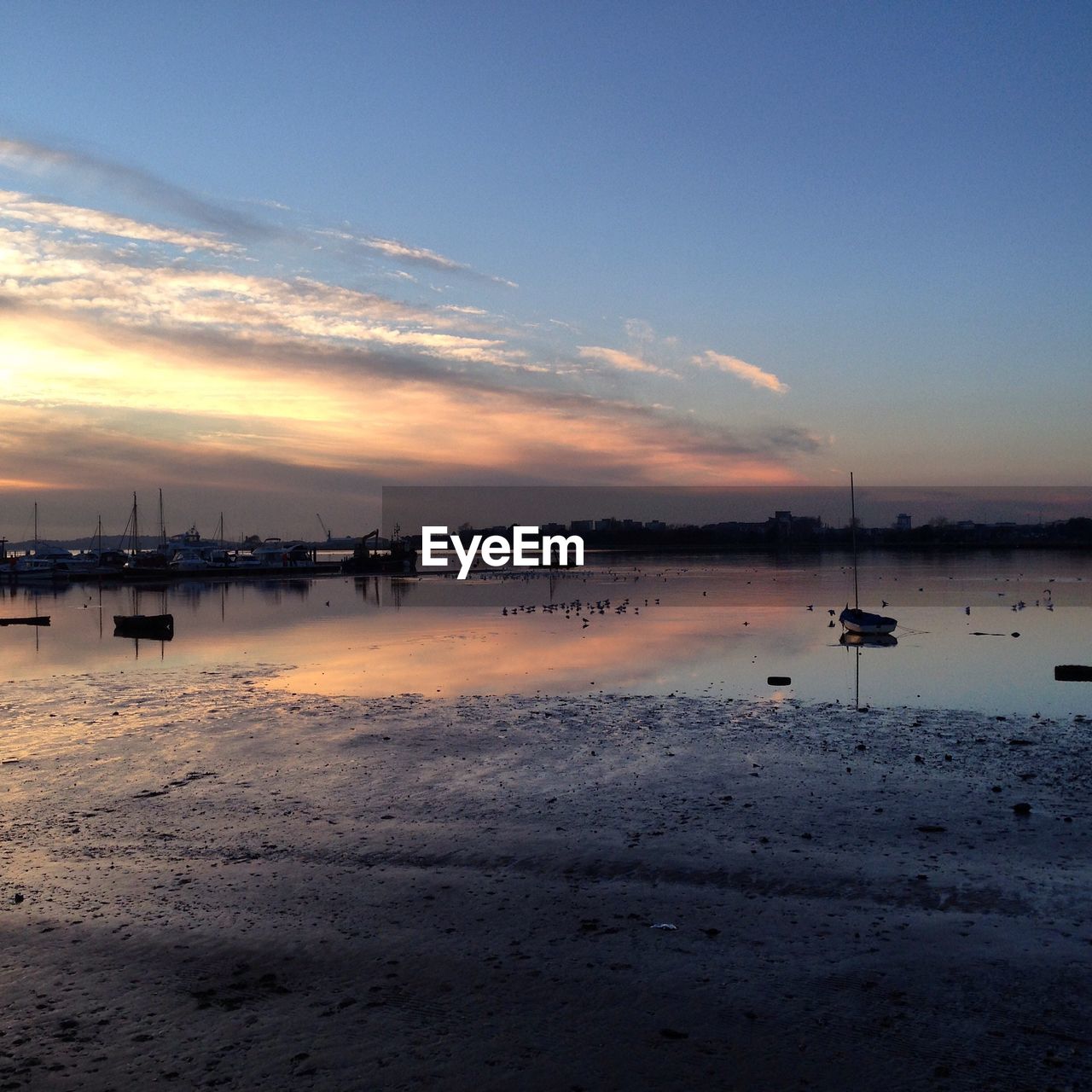 Scenic view of sea against sky at sunset