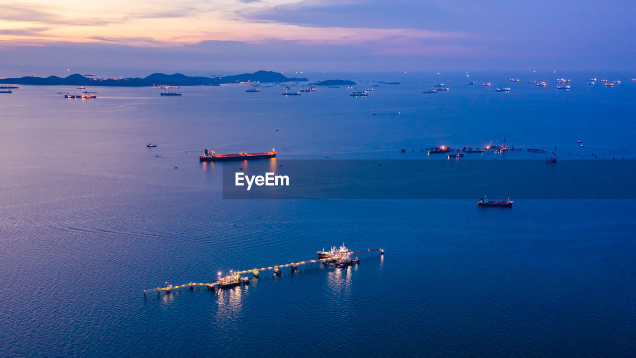 Aerial view of sea against sky at dusk