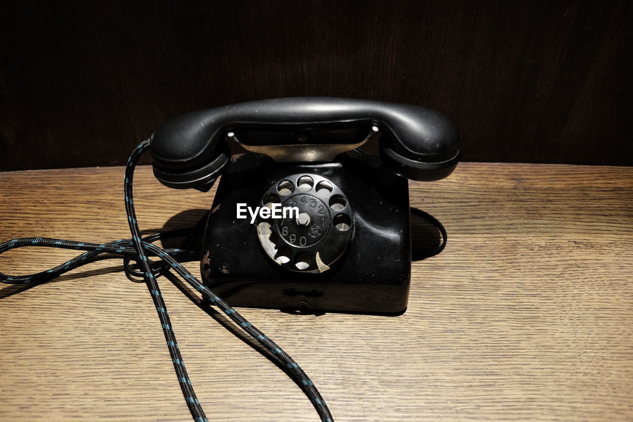 Telephone on wooden table