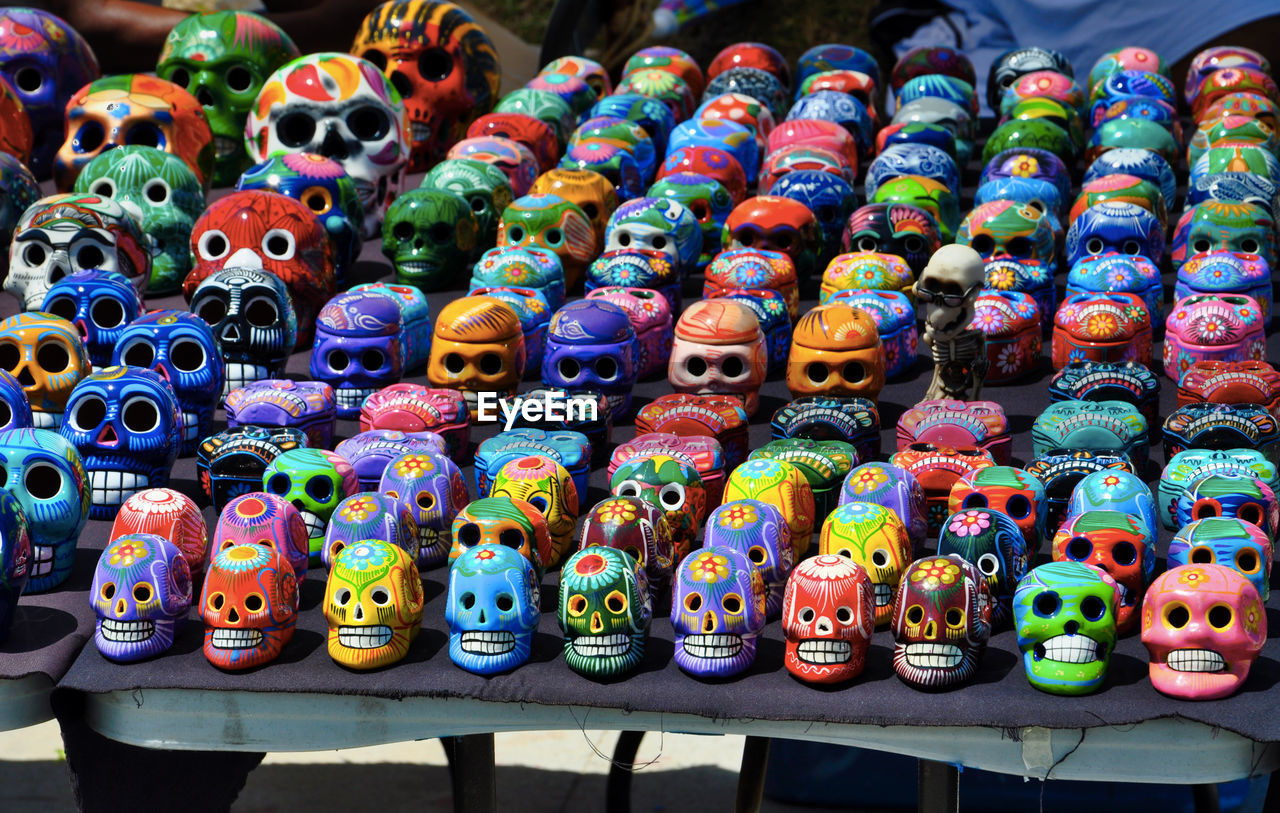 High angle view of colorful skulls for sale in market