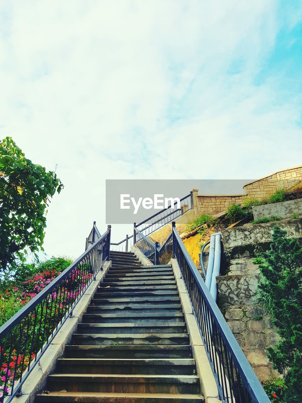 LOW ANGLE VIEW OF STAIRS LEADING TO STAIRCASE