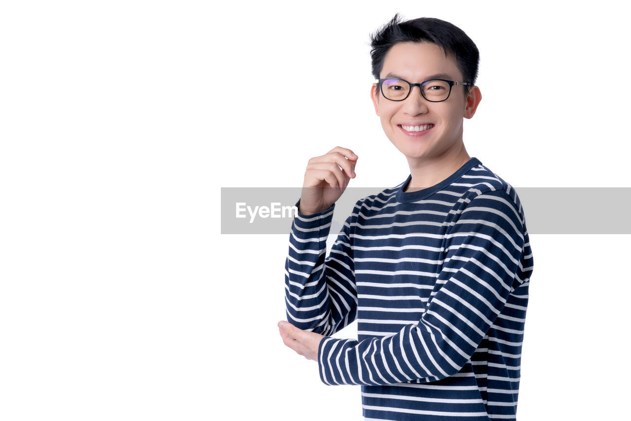 PORTRAIT OF A SMILING YOUNG MAN