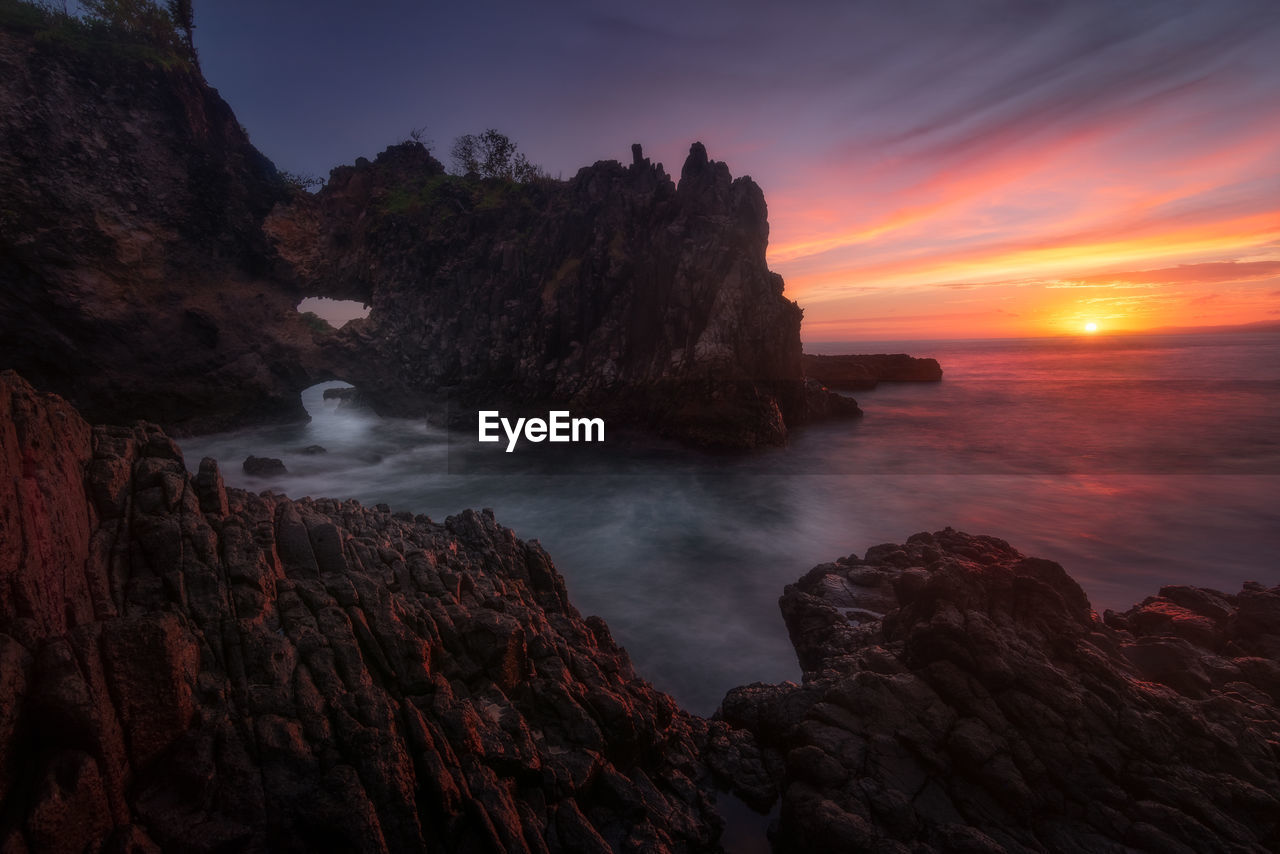 Scenic view of sea against sky during sunset