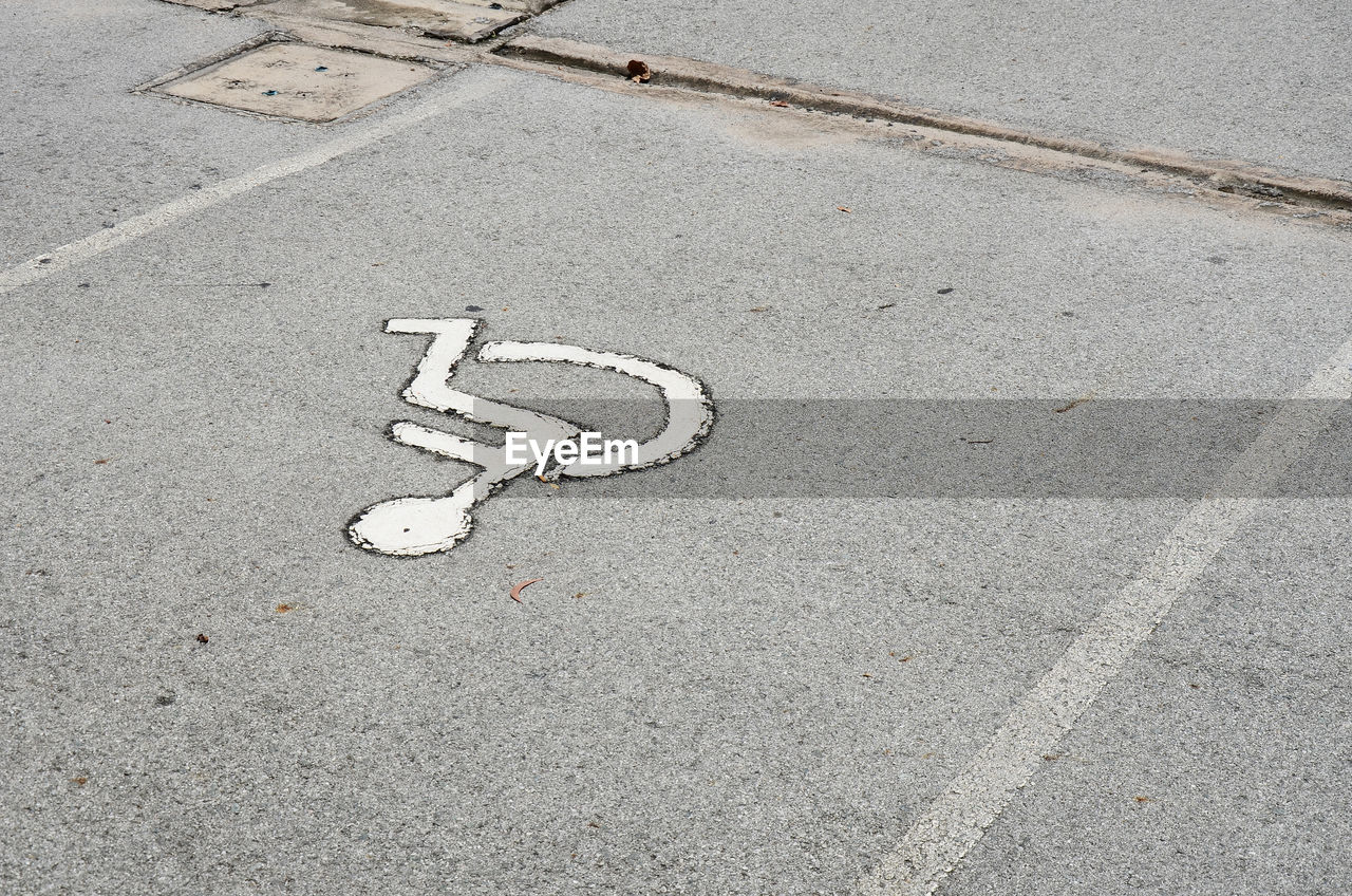 High angle view of arrow sign on road