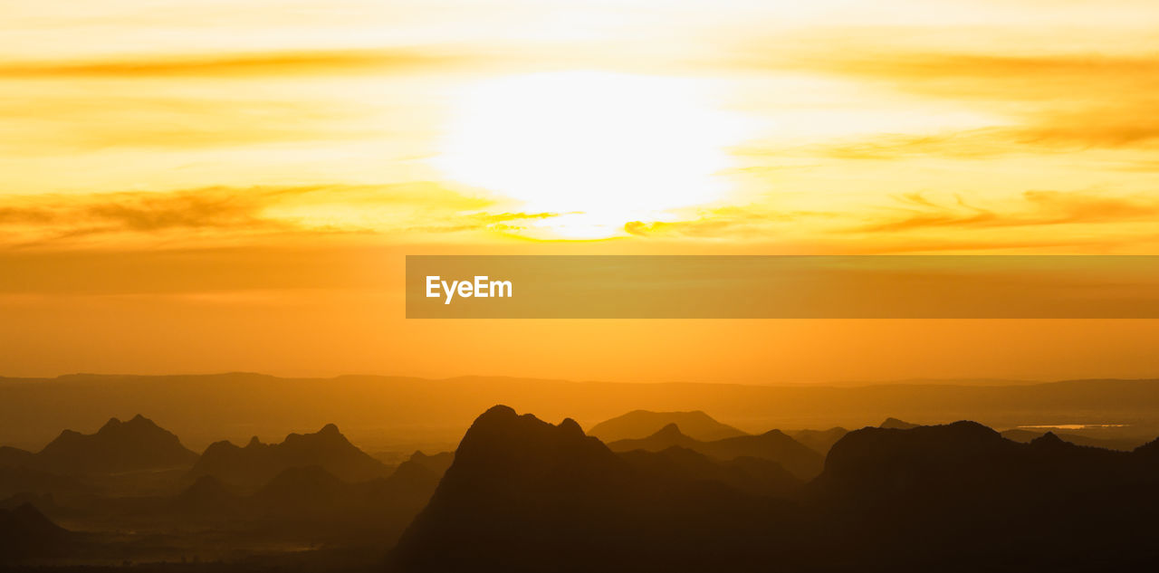 SILHOUETTE MOUNTAINS AGAINST SKY DURING SUNSET