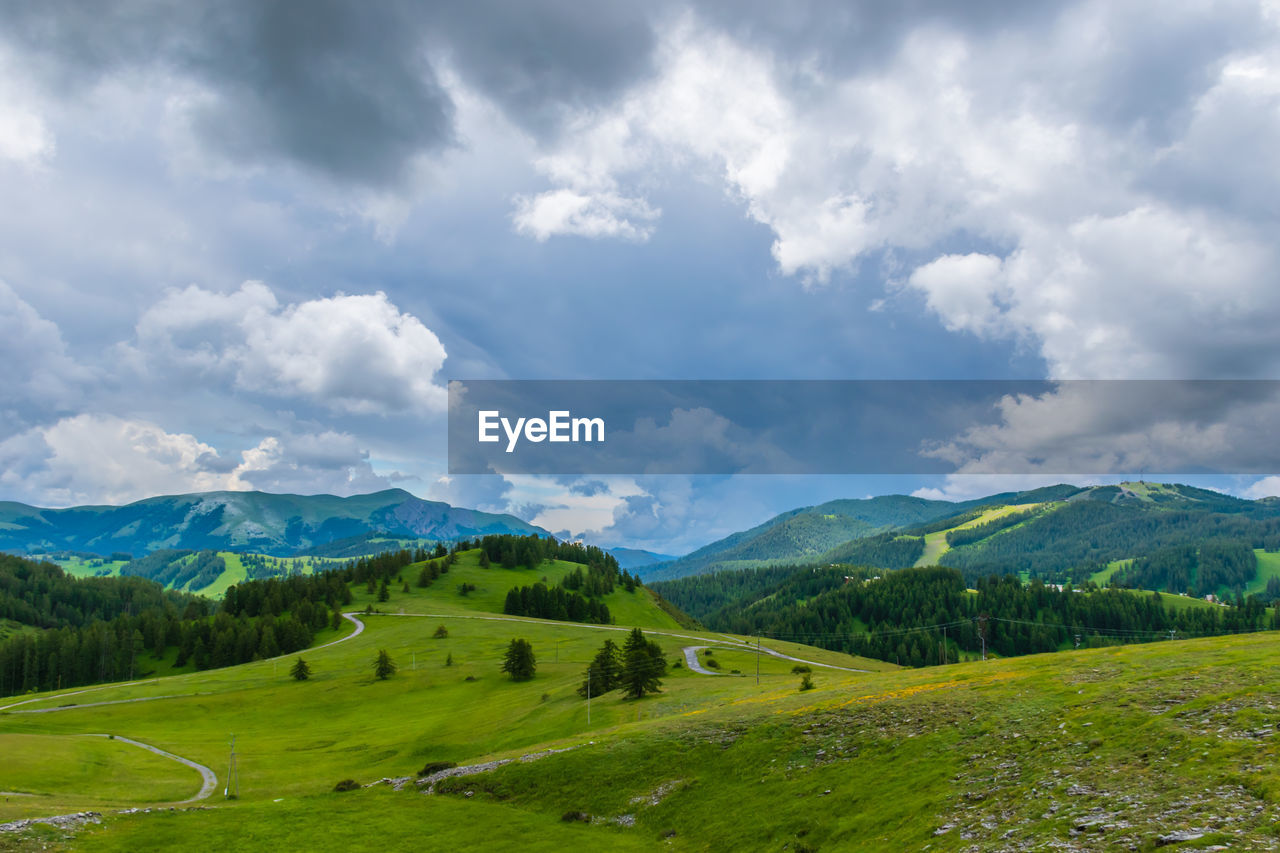 A picturesque landscape view of the french alps mountains on a cloudy summer day