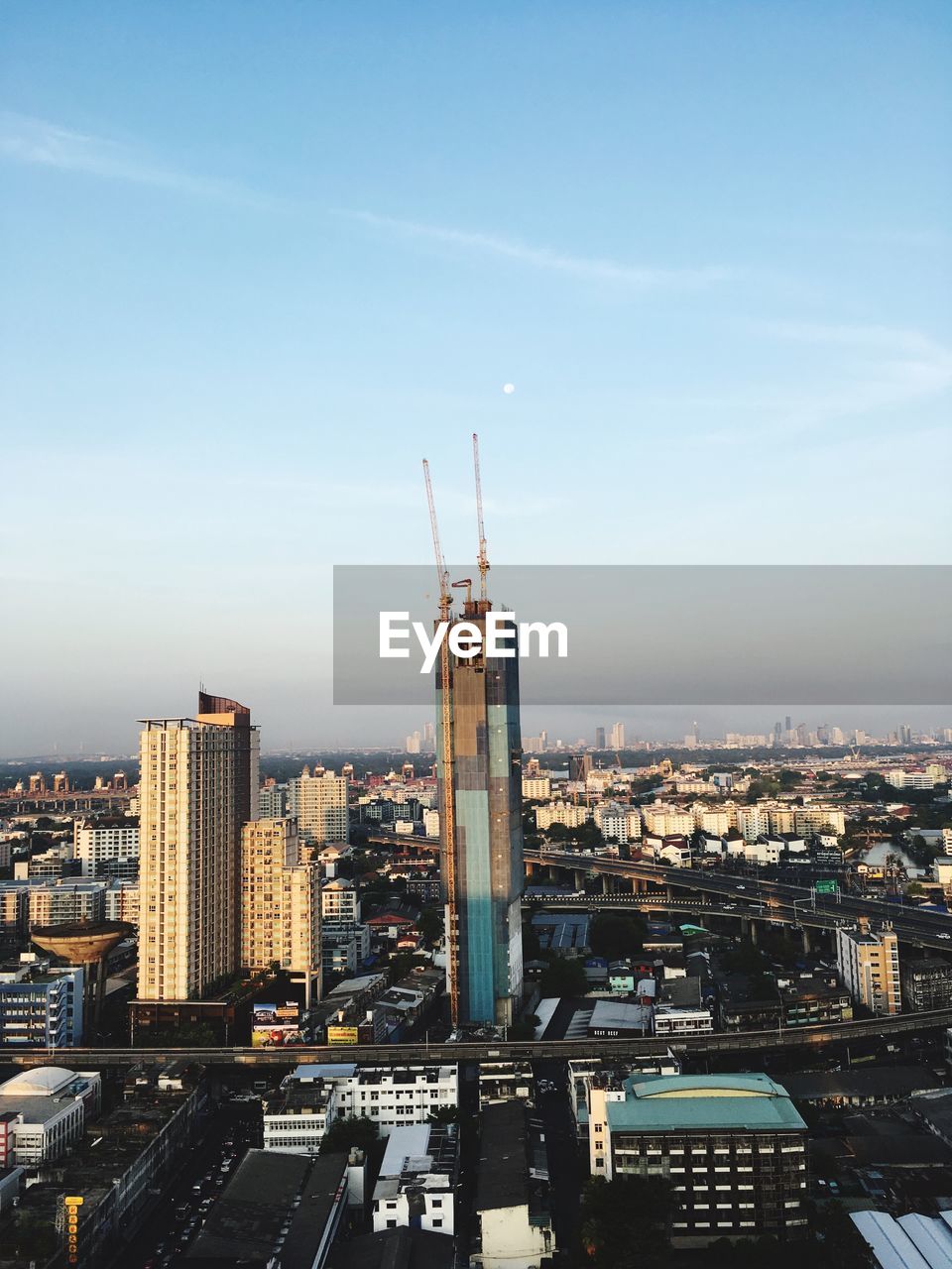 HIGH ANGLE VIEW OF CITY BUILDINGS AGAINST SKY