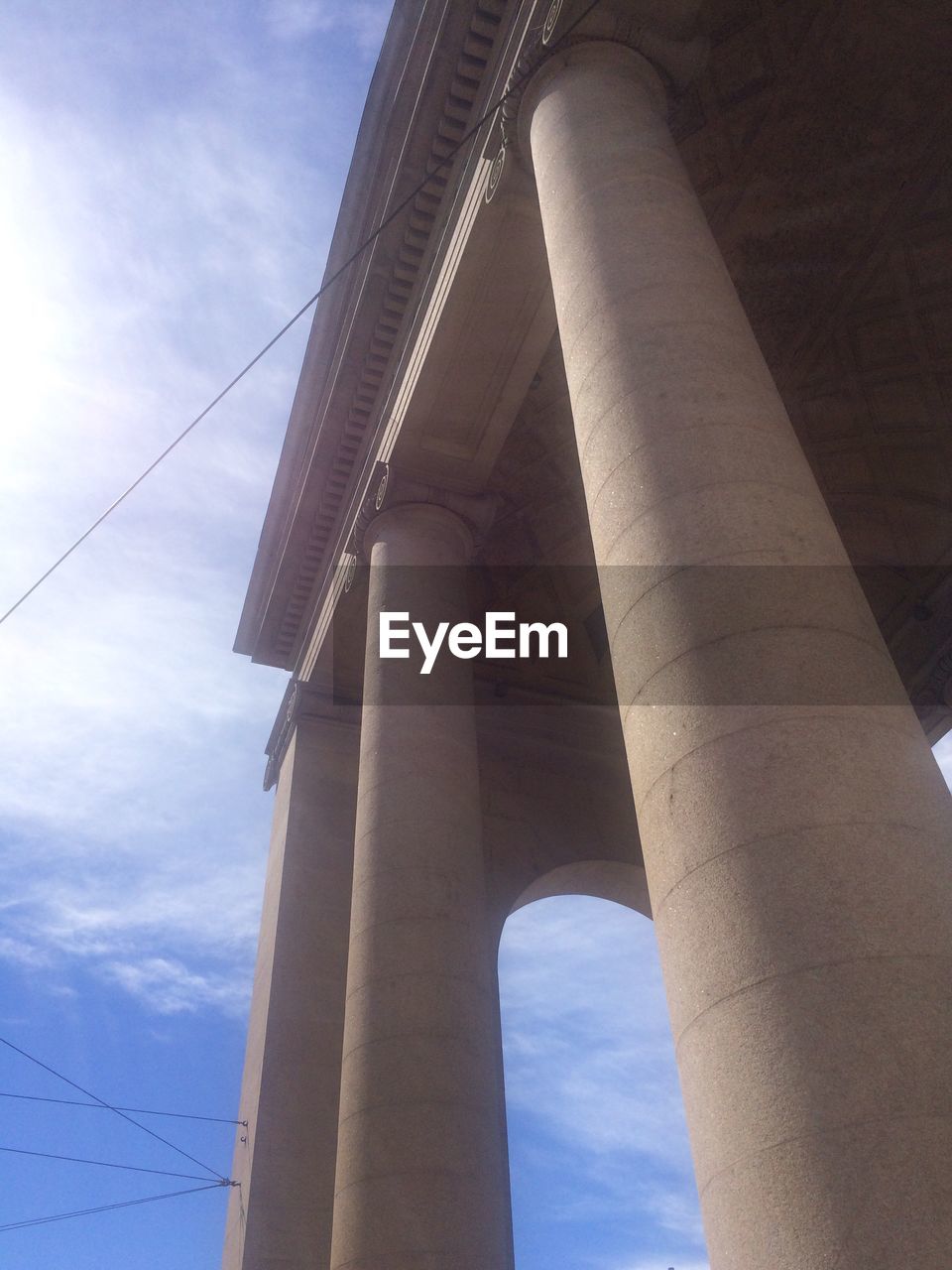 LOW ANGLE VIEW OF ARCHITECTURAL COLUMN AGAINST SKY