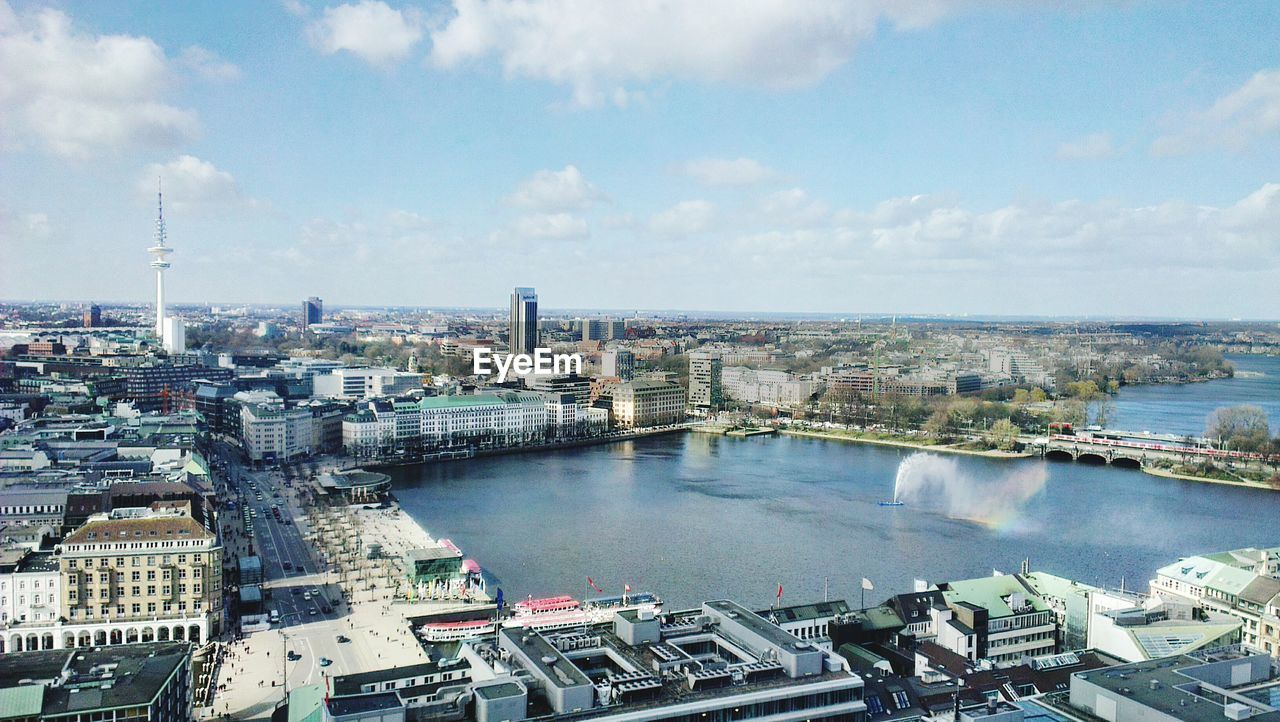 High angle view of river and buildings in city