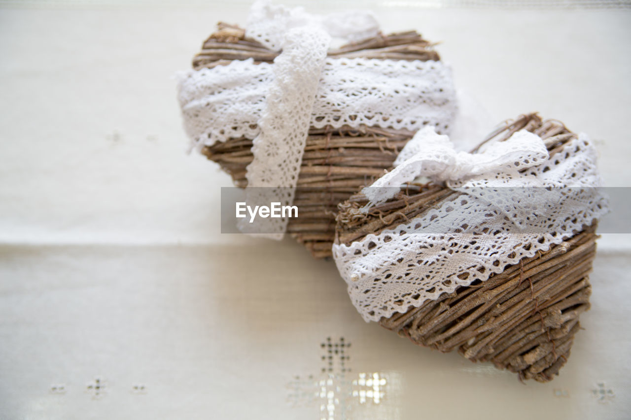 Directly above shot of heart shape decoration on table at wedding