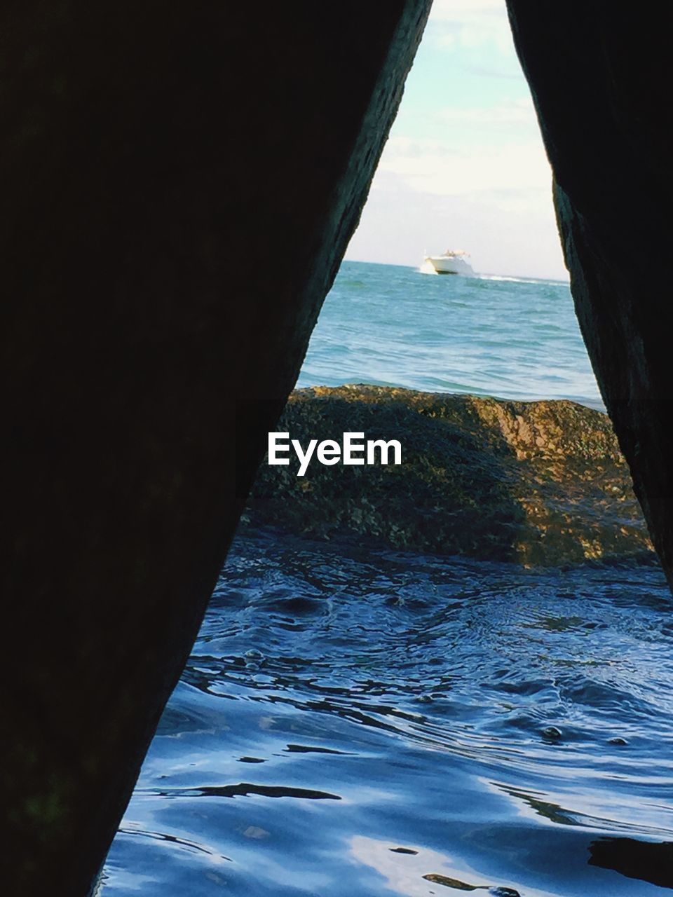 Close-up of sea against sky seen through window