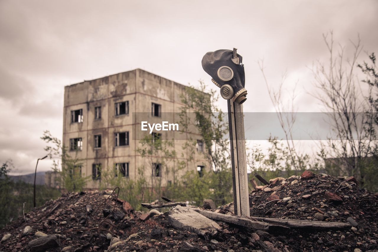 Low angle view of old building against cloudy sky