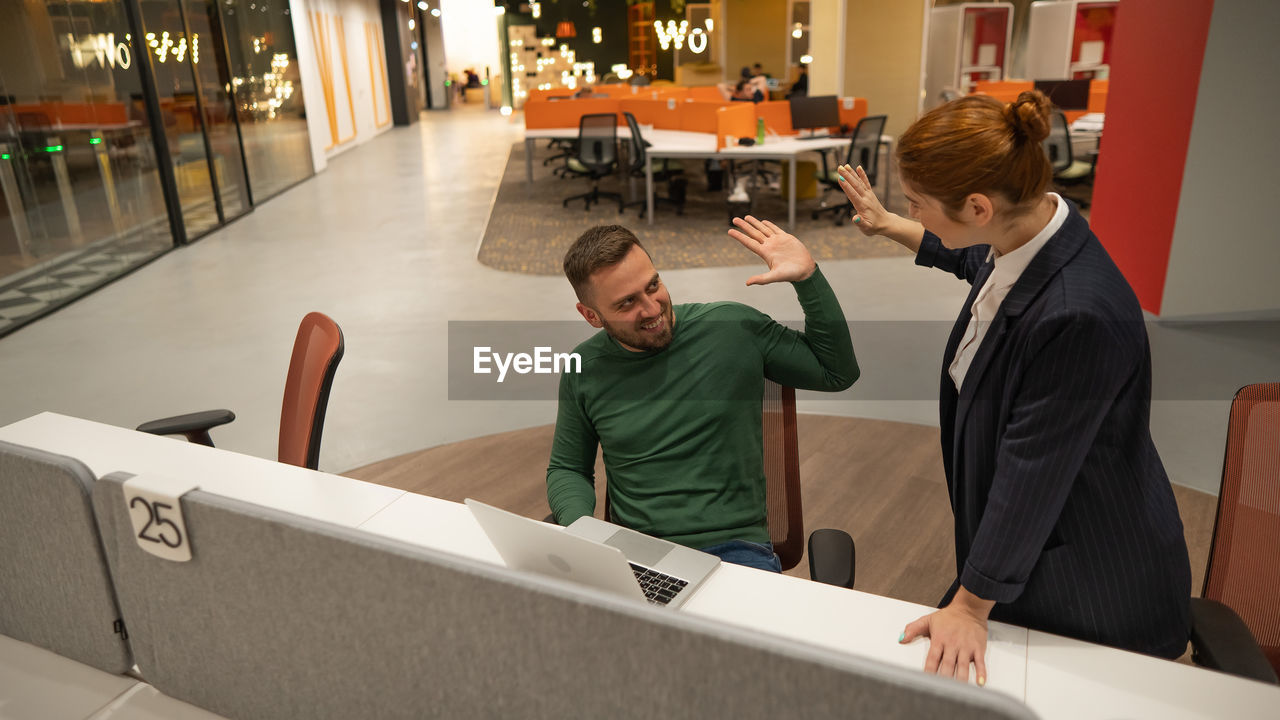 high angle view of business colleagues working at home