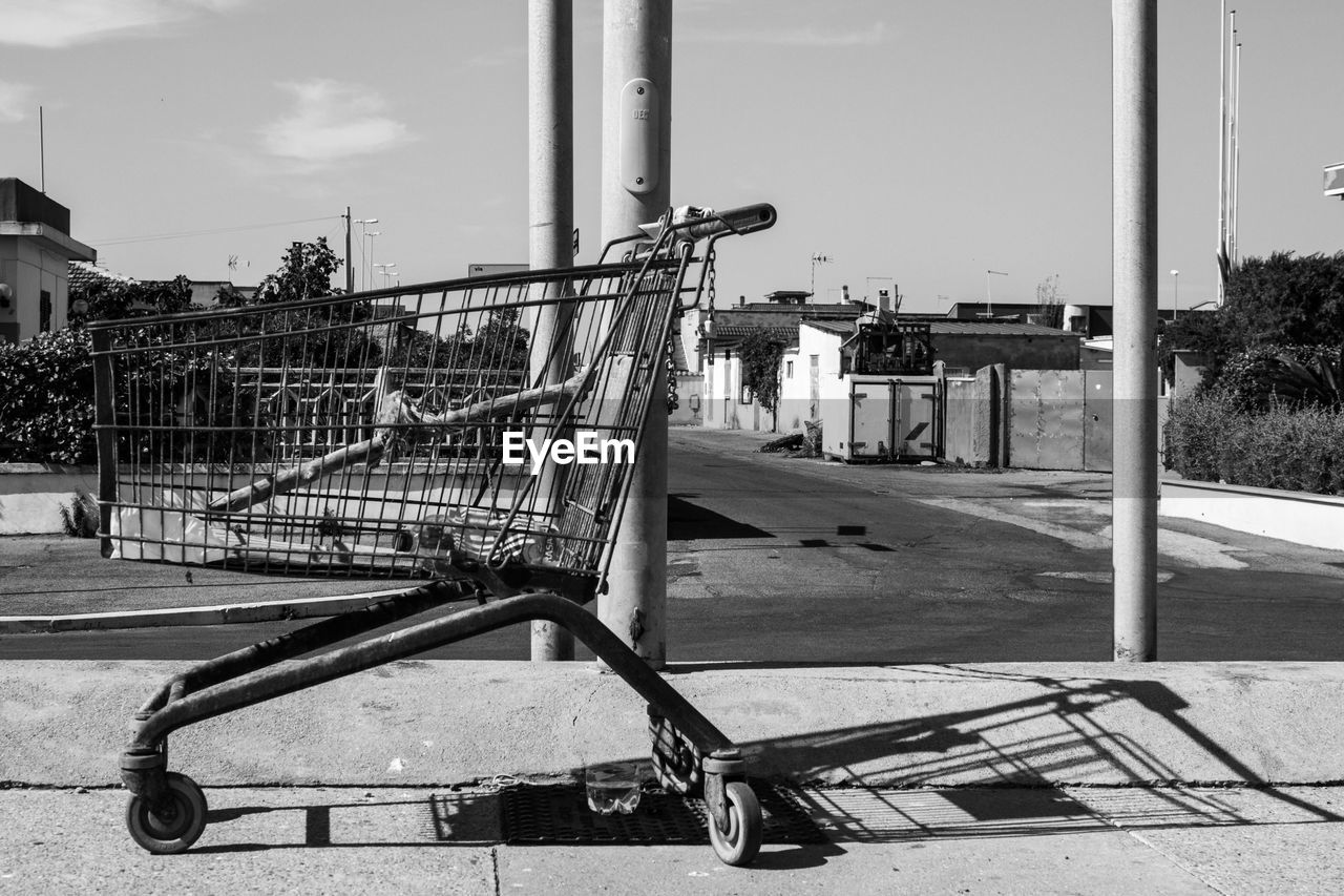 Abandoned shopping cart on sidewalk