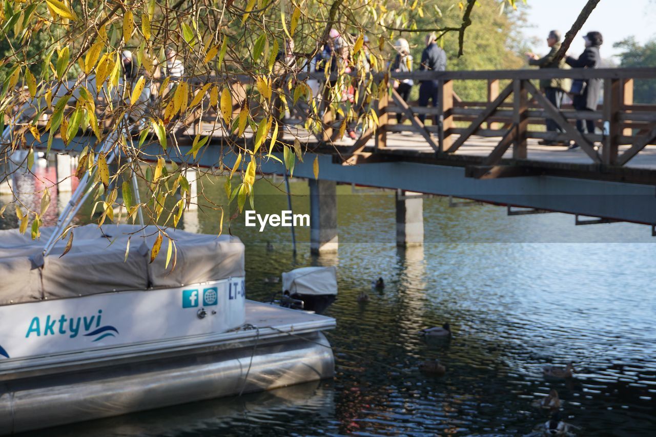 BOATS MOORED AT LAKE