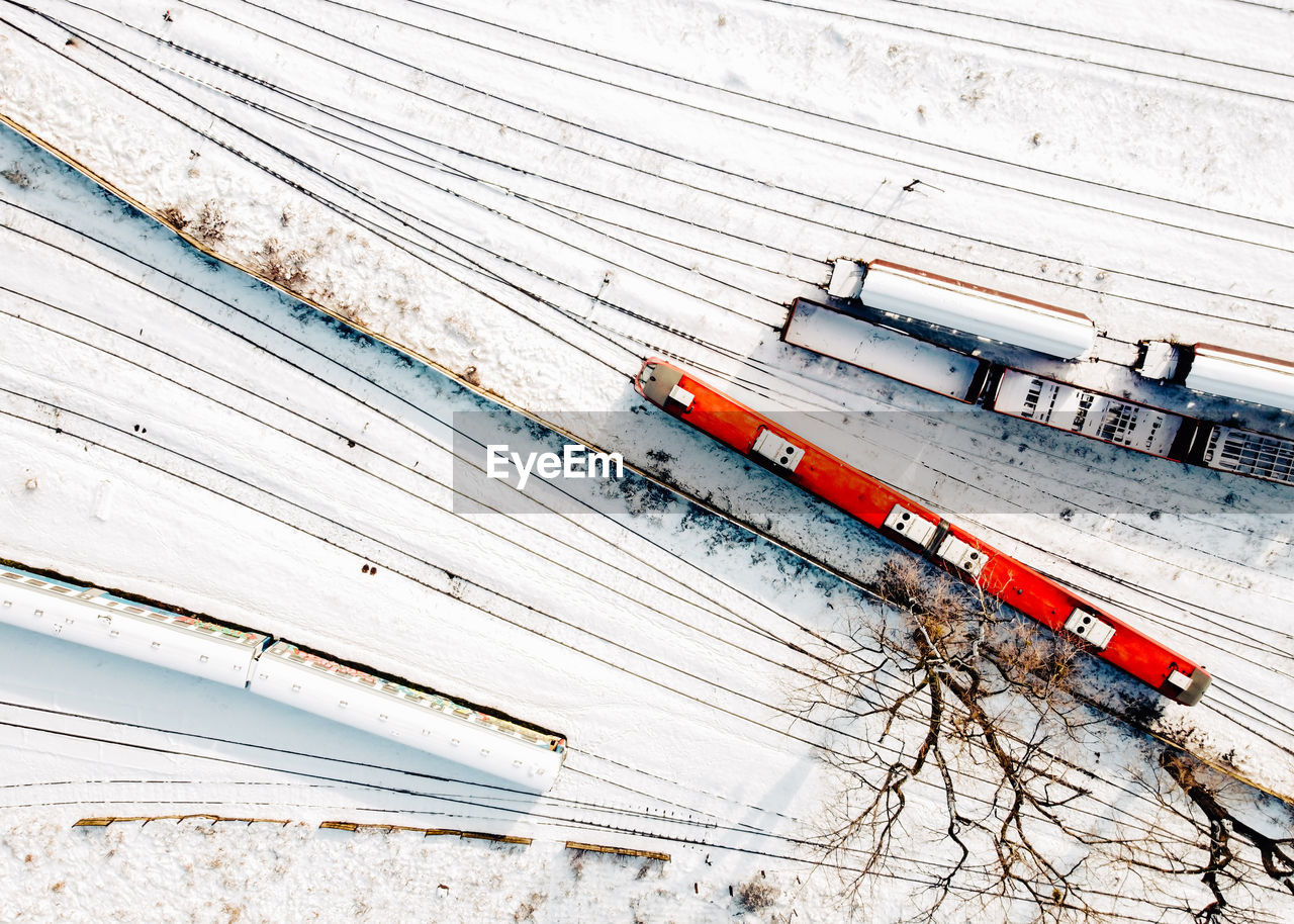 Top view of cargo trains and passenger diesel multiple units. aerial top view from flying drone.