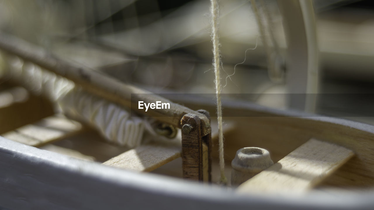 CLOSE-UP OF MACHINE PART ON METAL