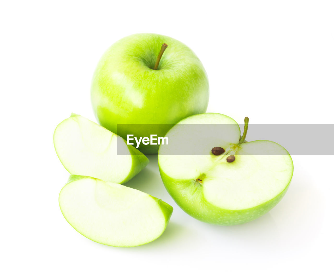 High angle view of granny smith apples against white background