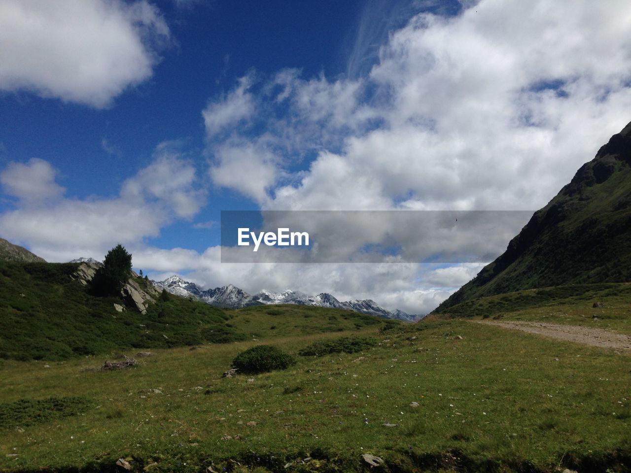 Scenic view of landscape and mountains against sky