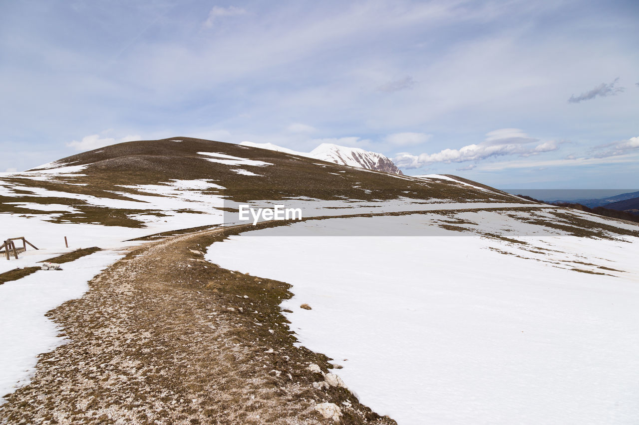 Scenic view of snowcapped mountain against sky