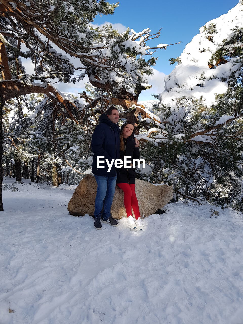 FULL LENGTH OF WOMAN WALKING IN SNOW