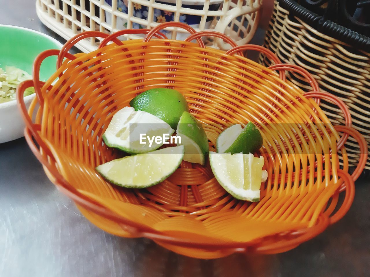 High angle view of fruit in basket on table