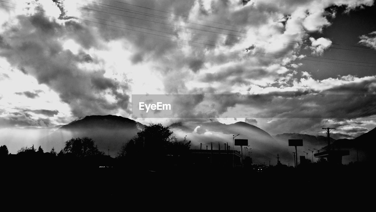 SCENIC VIEW OF SKY OVER SILHOUETTE TREES AGAINST CLOUDY DAY