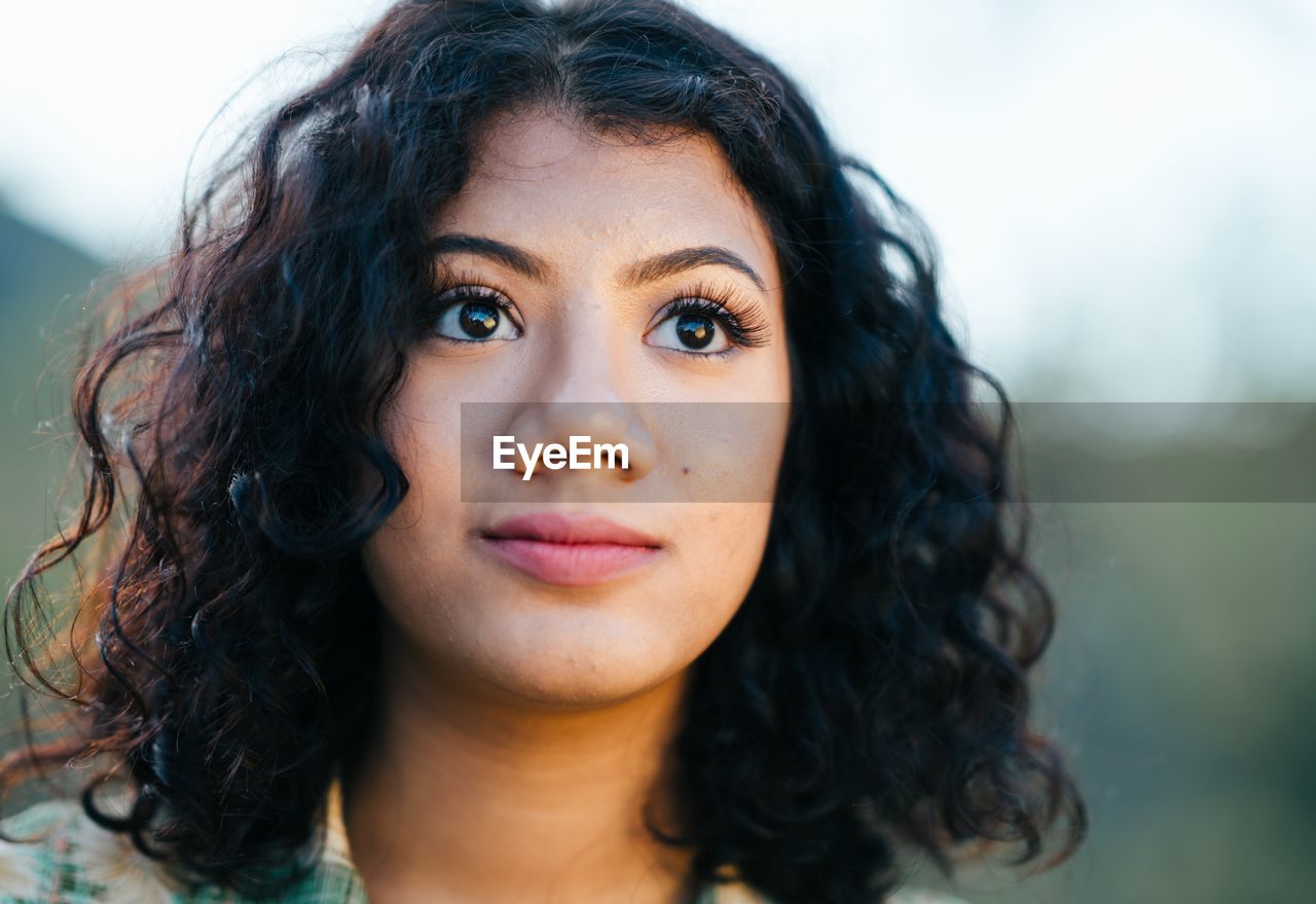 PORTRAIT OF BEAUTIFUL YOUNG WOMAN WITH EYES