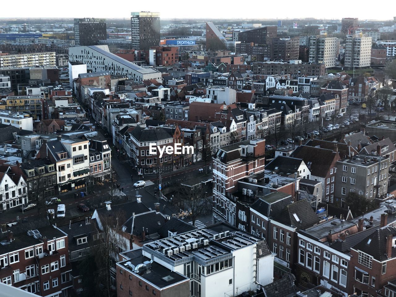 HIGH ANGLE VIEW OF ILLUMINATED CITY BUILDINGS