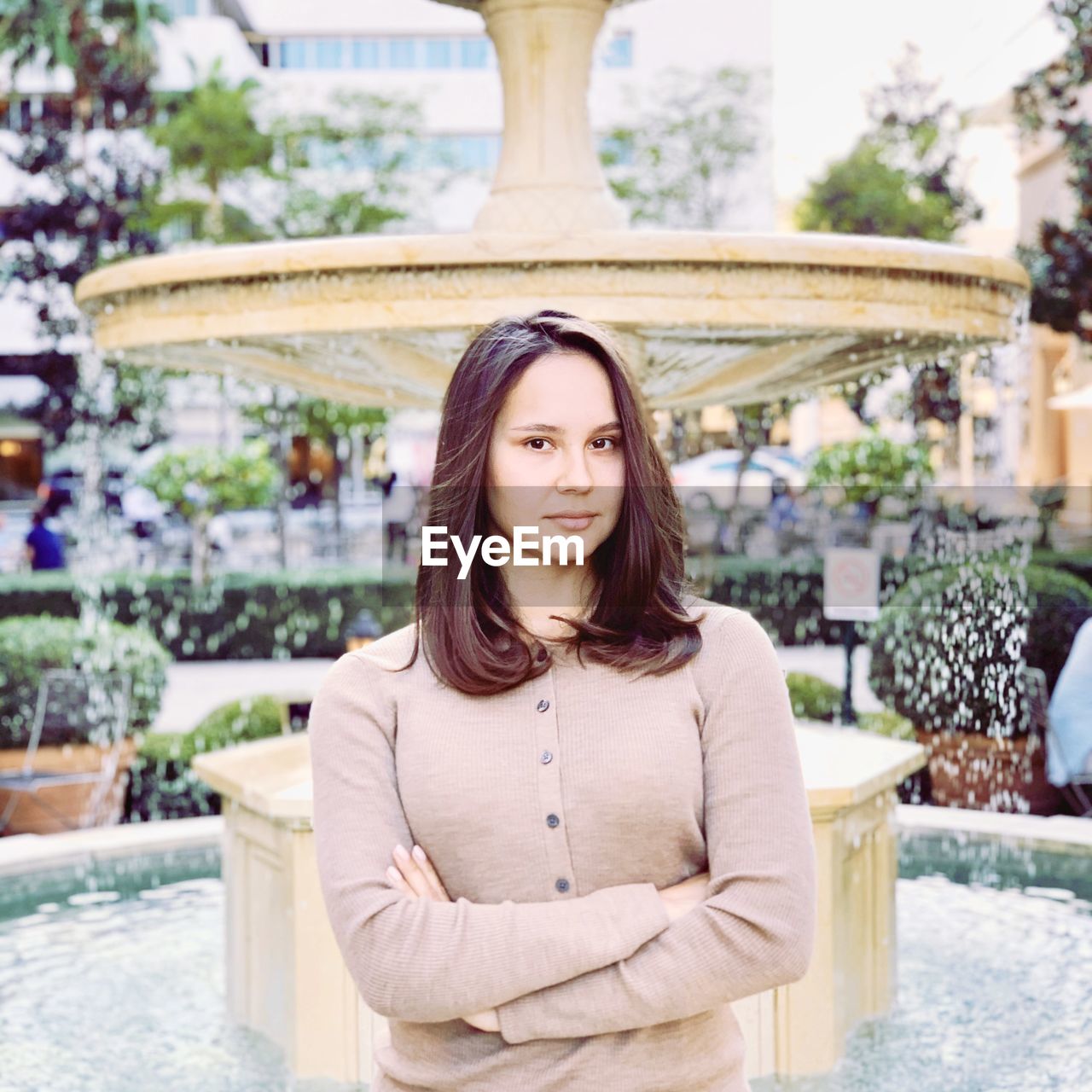 Portrait of a young girl at the fountain.