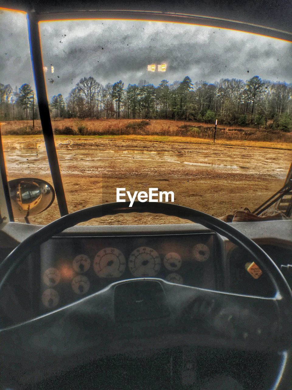 ROAD SEEN THROUGH WET WINDOW