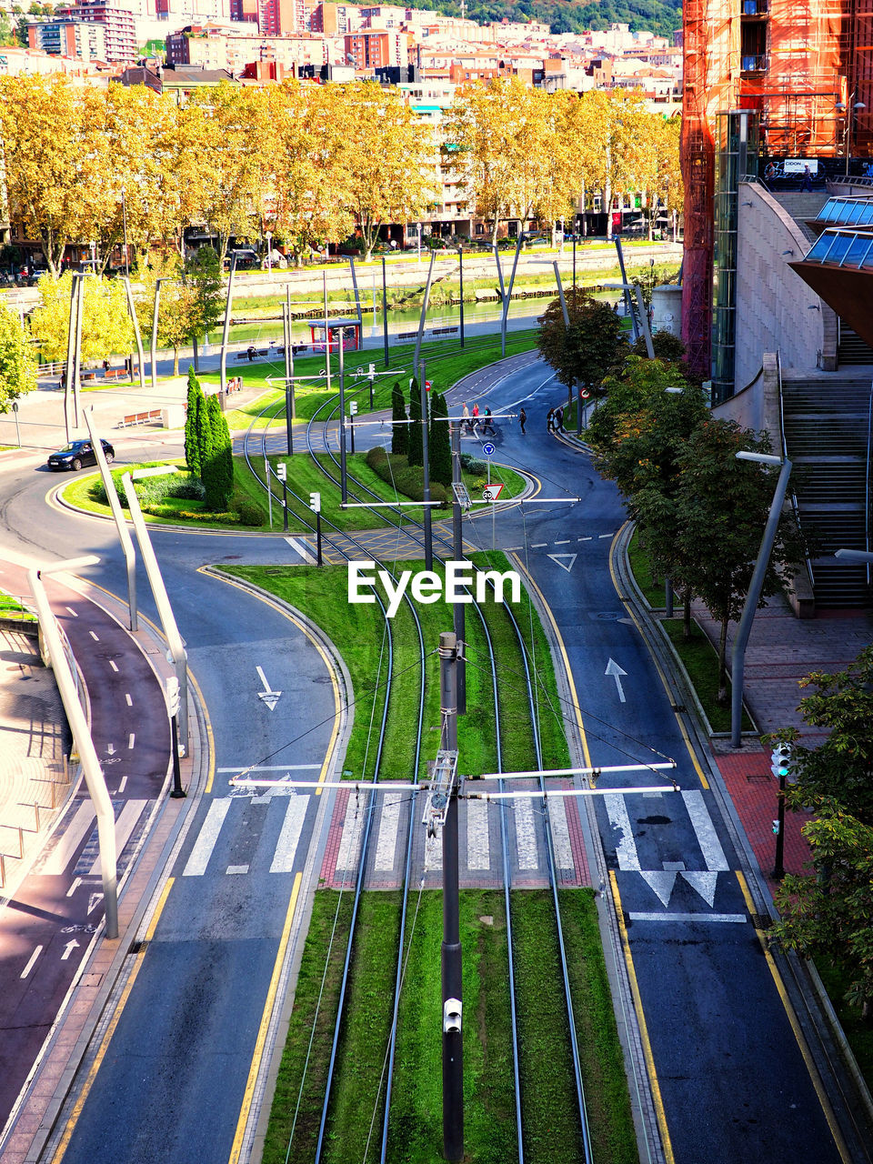 HIGH ANGLE VIEW OF STREET AMIDST CITY