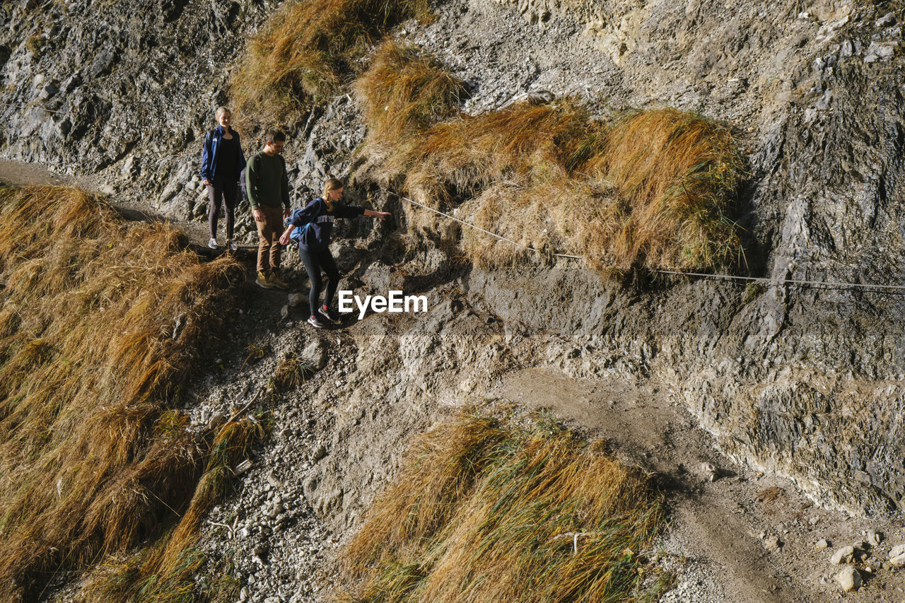 High angle view of people on rock formation