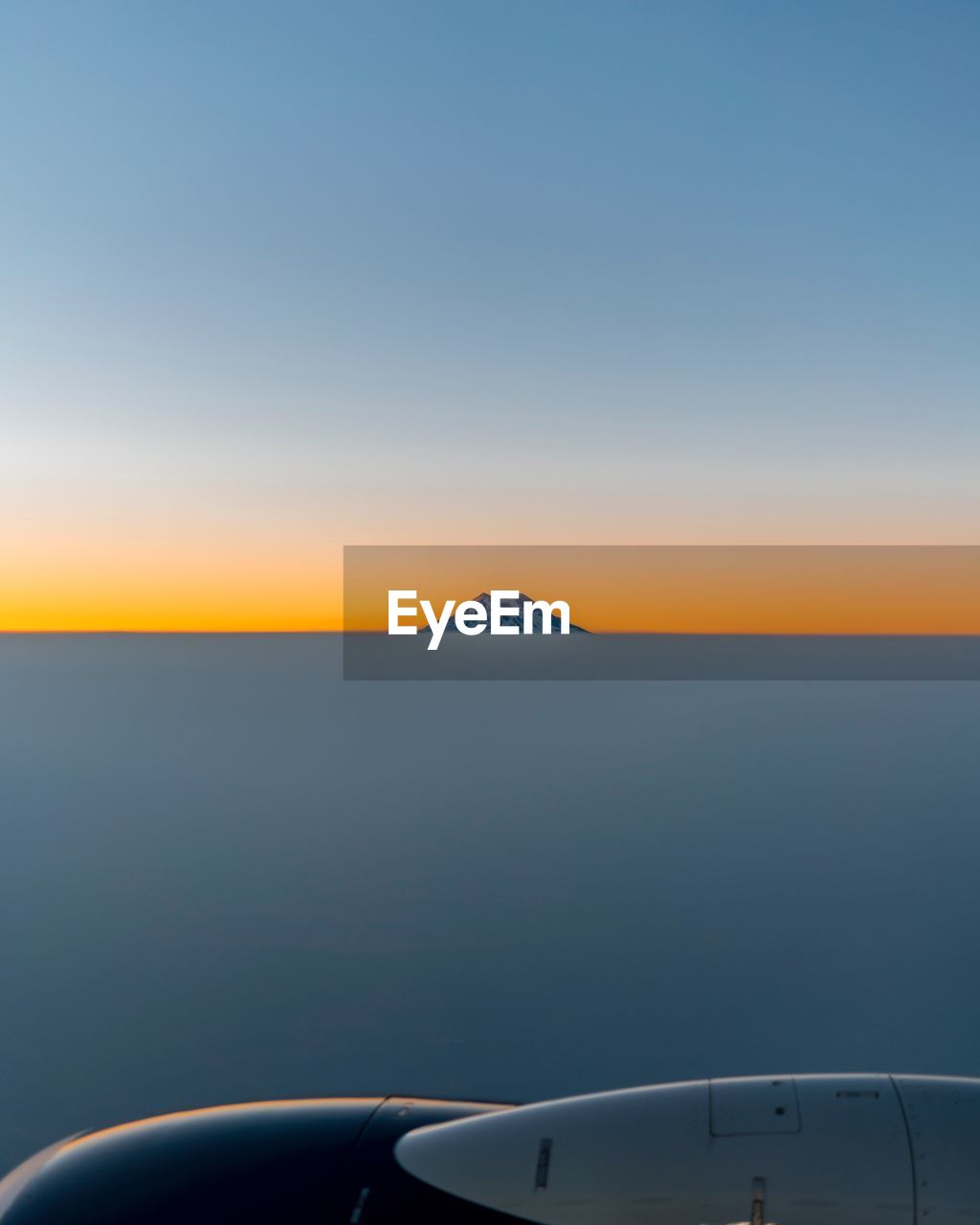 CLOSE-UP OF AIRPLANE WING AGAINST CLEAR SKY