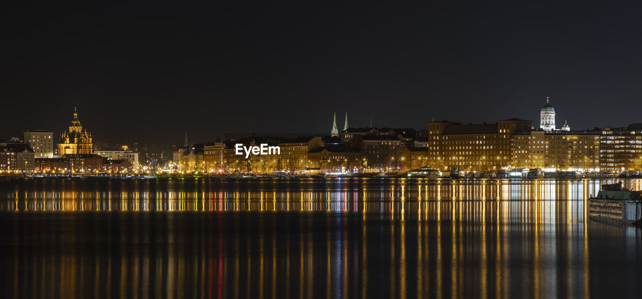 Illuminated buildings at waterfront