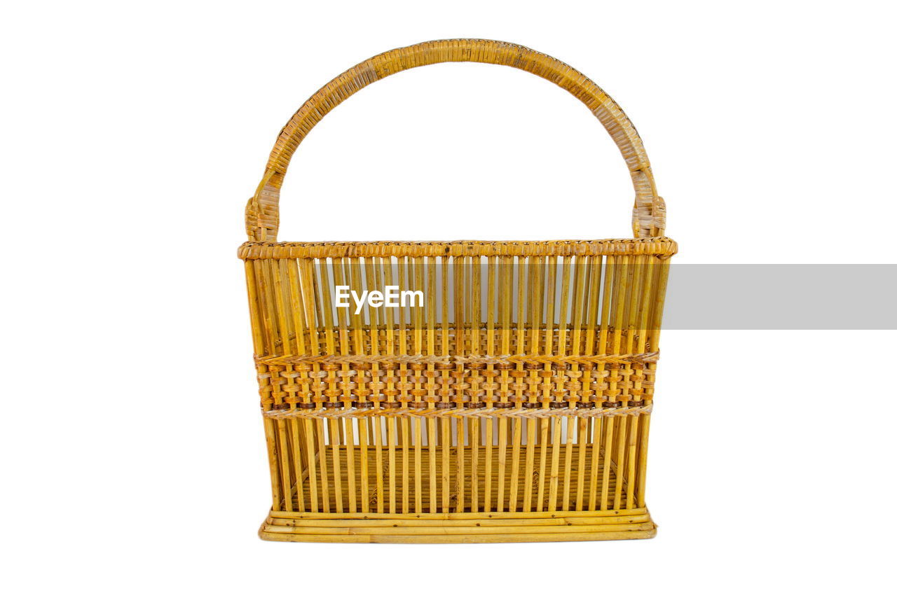 CLOSE-UP OF YELLOW WICKER BASKET