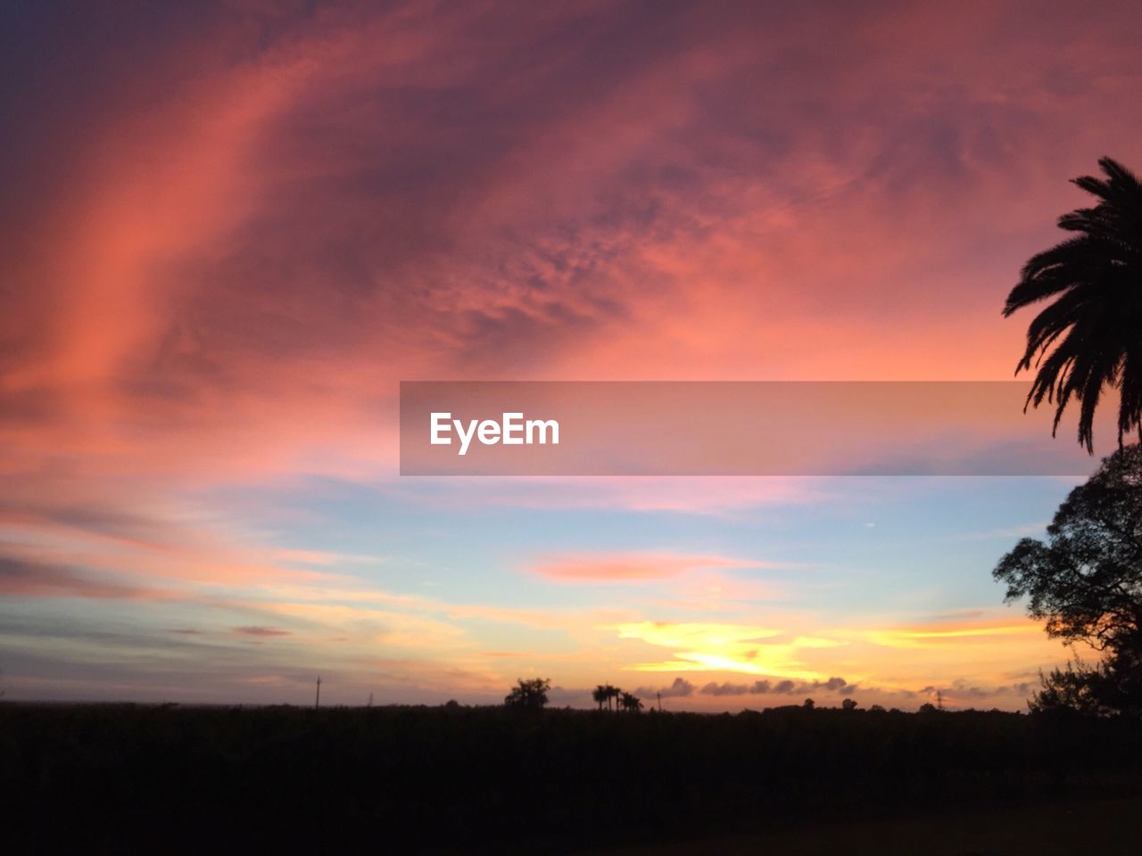 SCENIC VIEW OF SILHOUETTE LANDSCAPE AGAINST DRAMATIC SKY