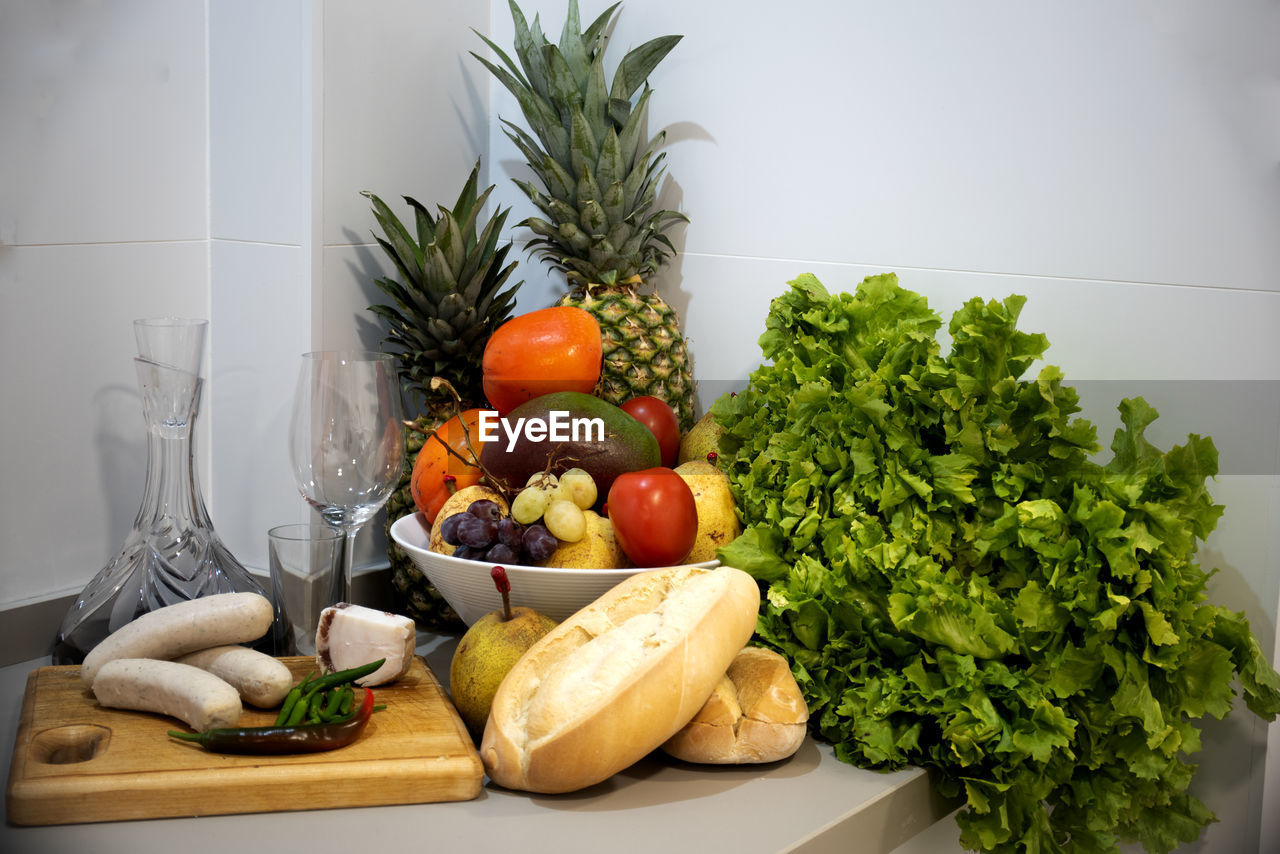 Set of fruits and vegetables in a still life on the kitchen counter