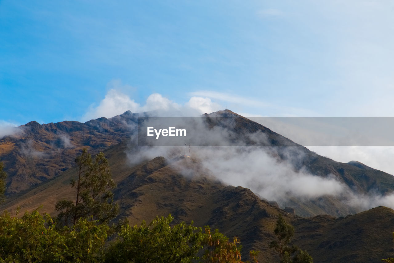 Scenic view of volcanic mountain against sky