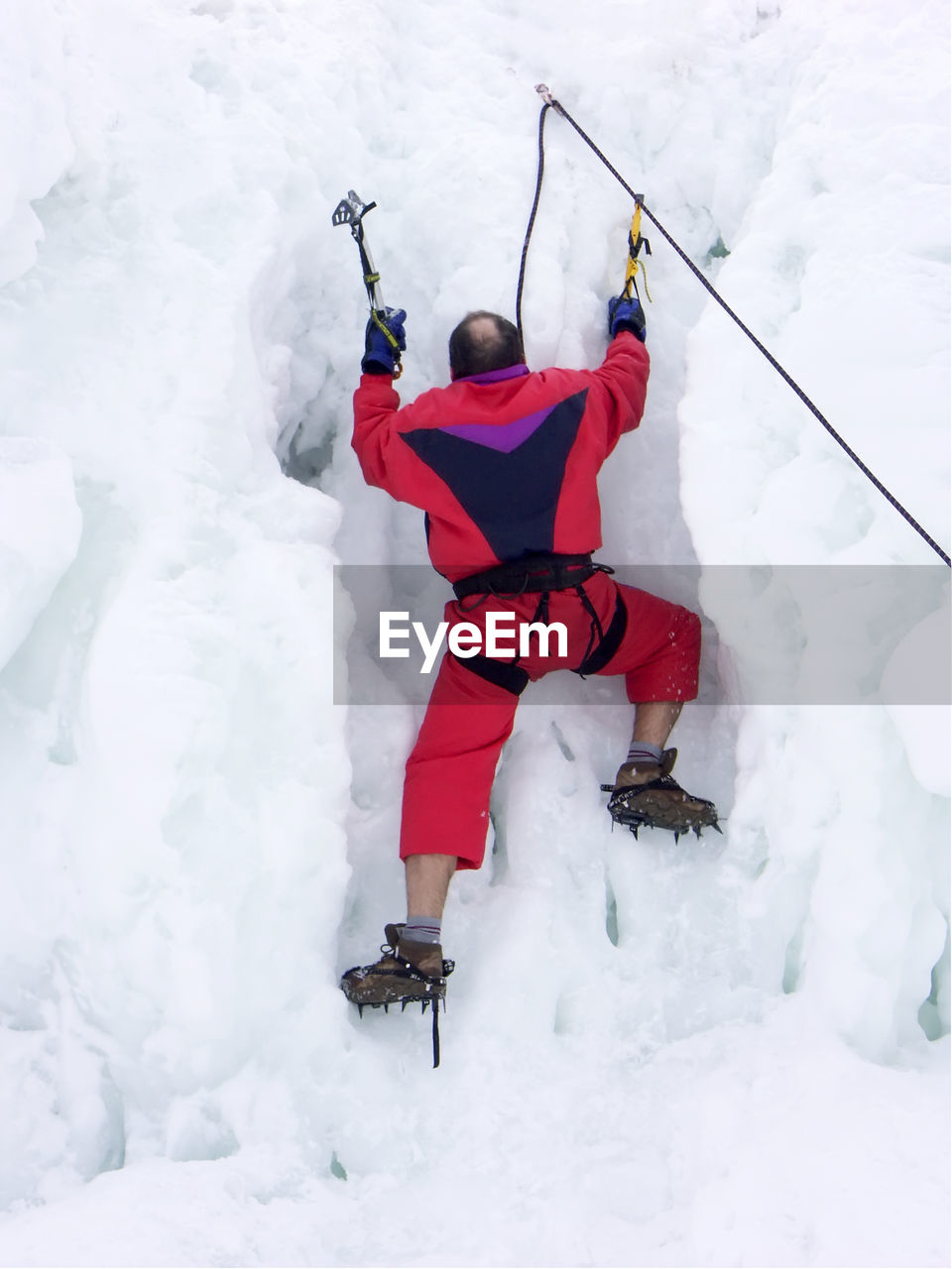 Climber climbing the iceberg