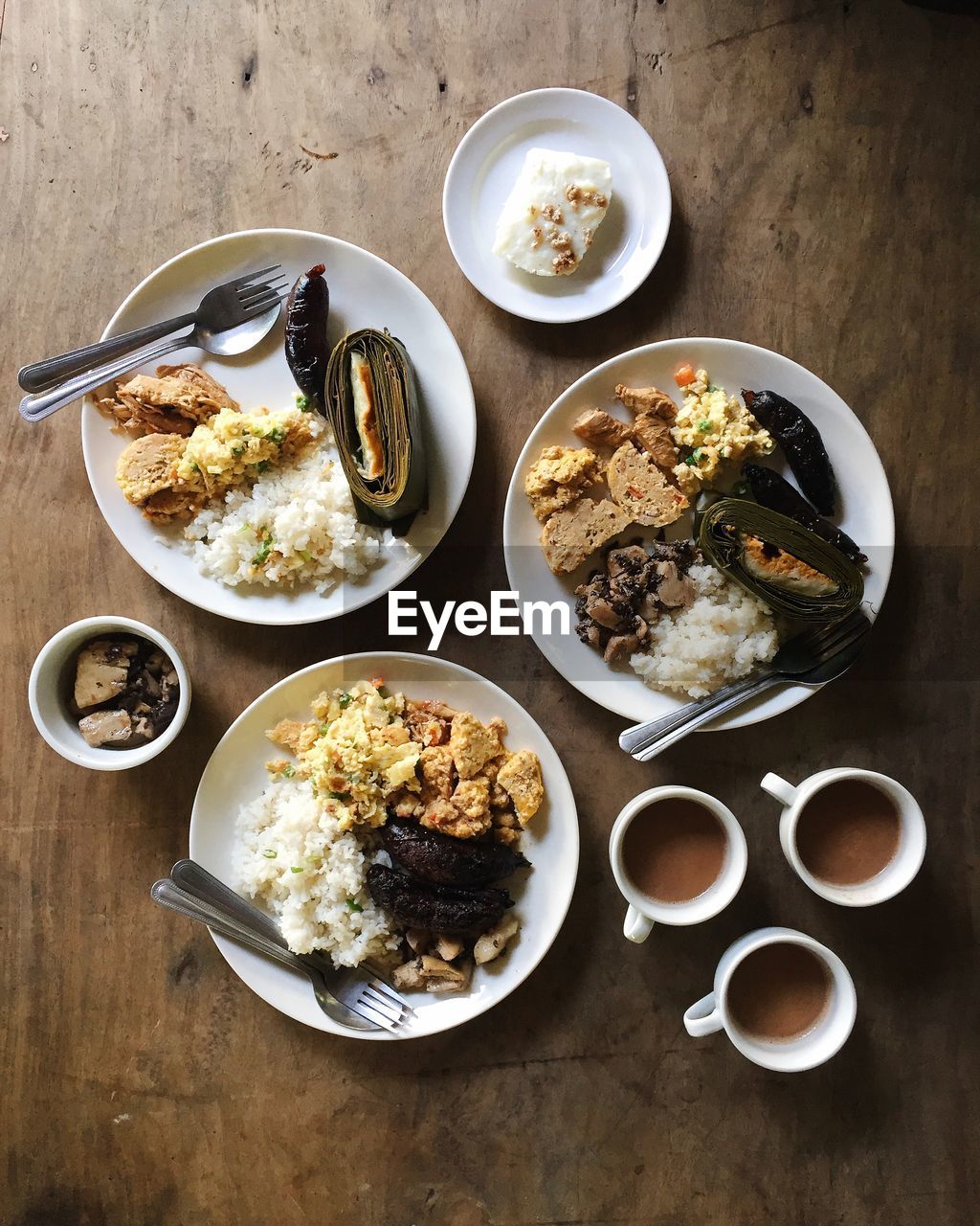 High angle view of food and drink on wooden table