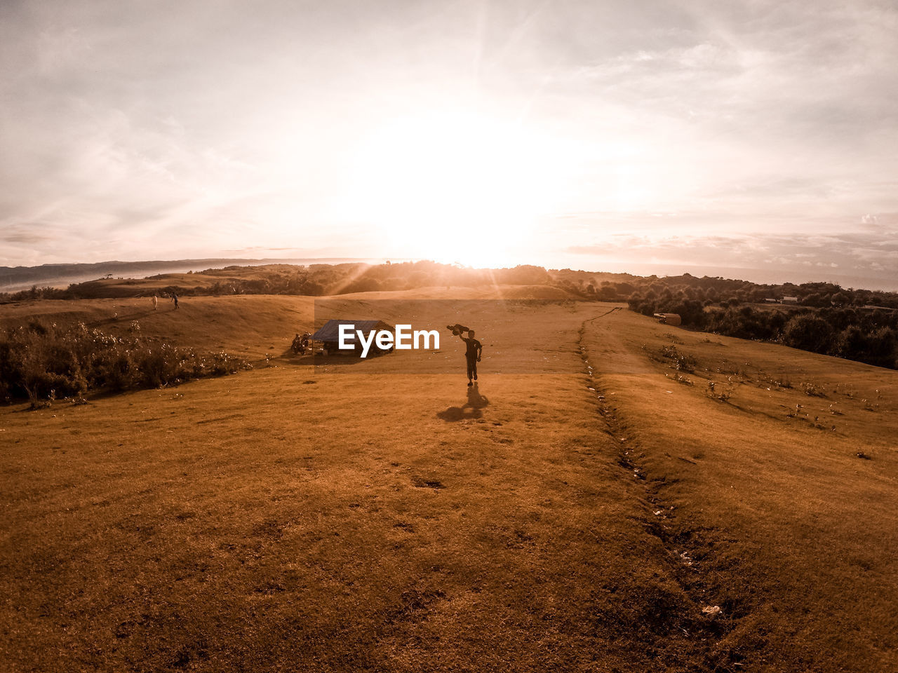 Scenic view of field against sky during sunrice