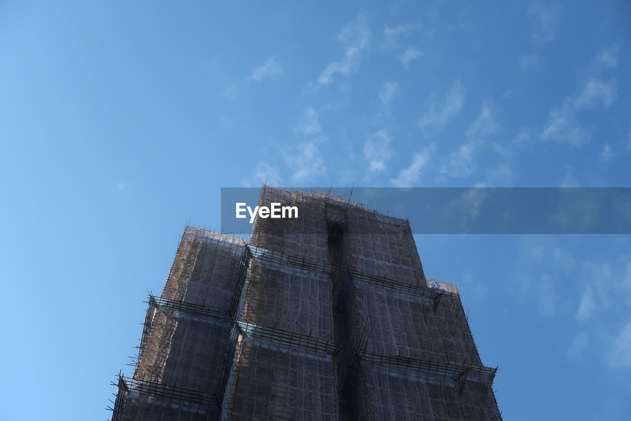 Low angle view of building against blue sky