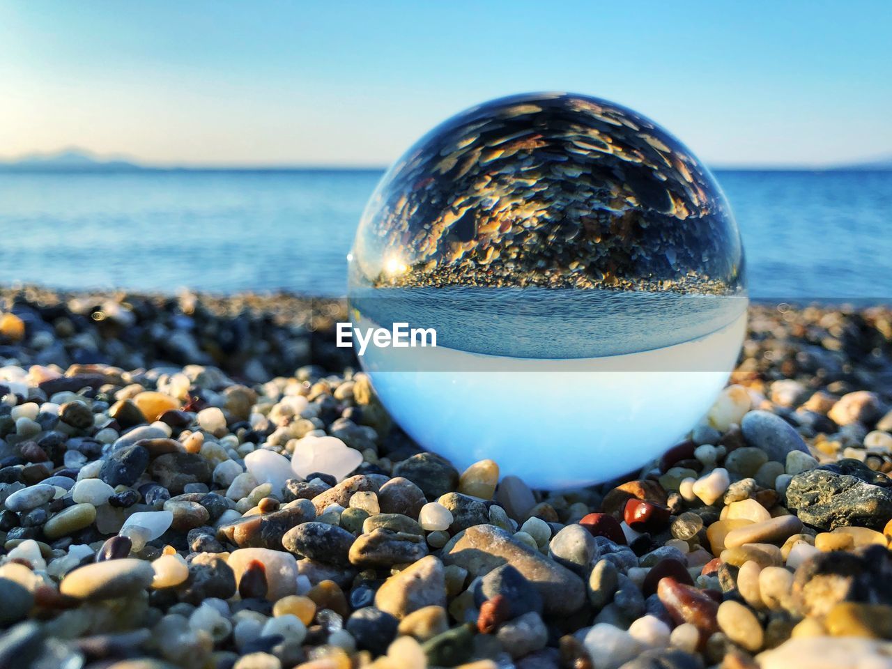 Sea view mirrored in a glass ball