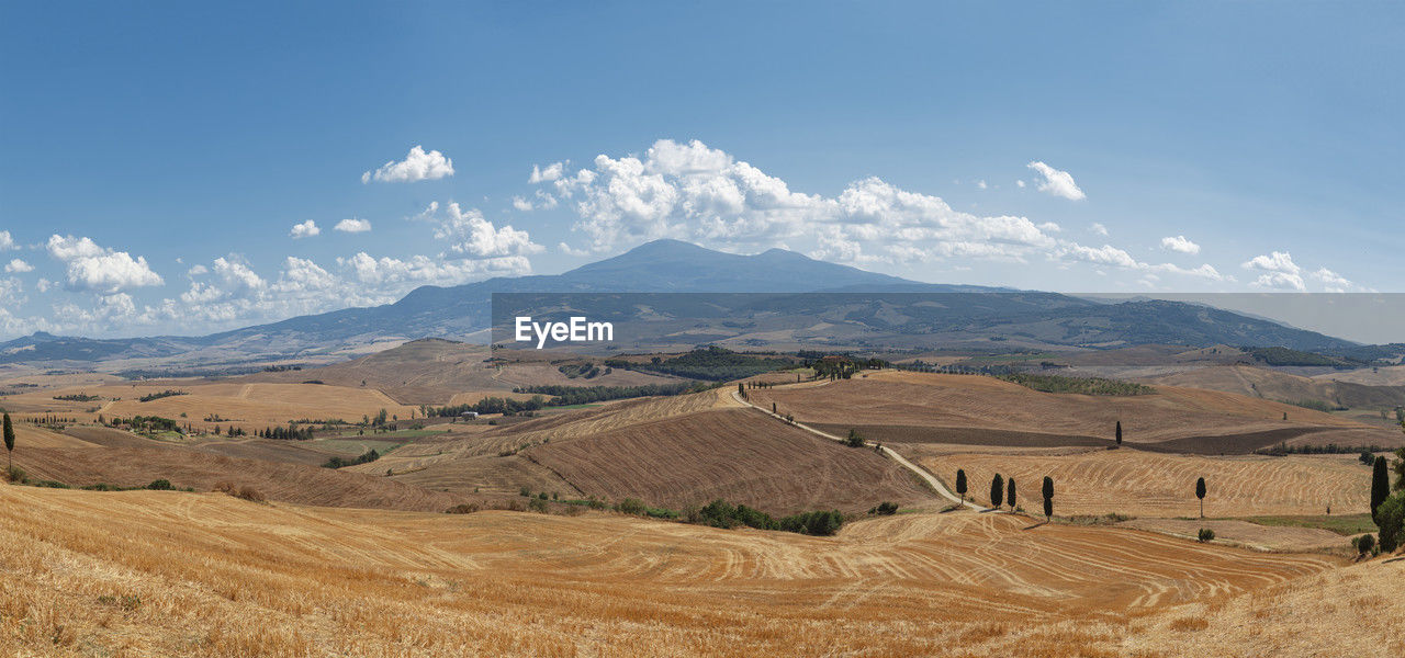 scenic view of landscape and mountains against sky