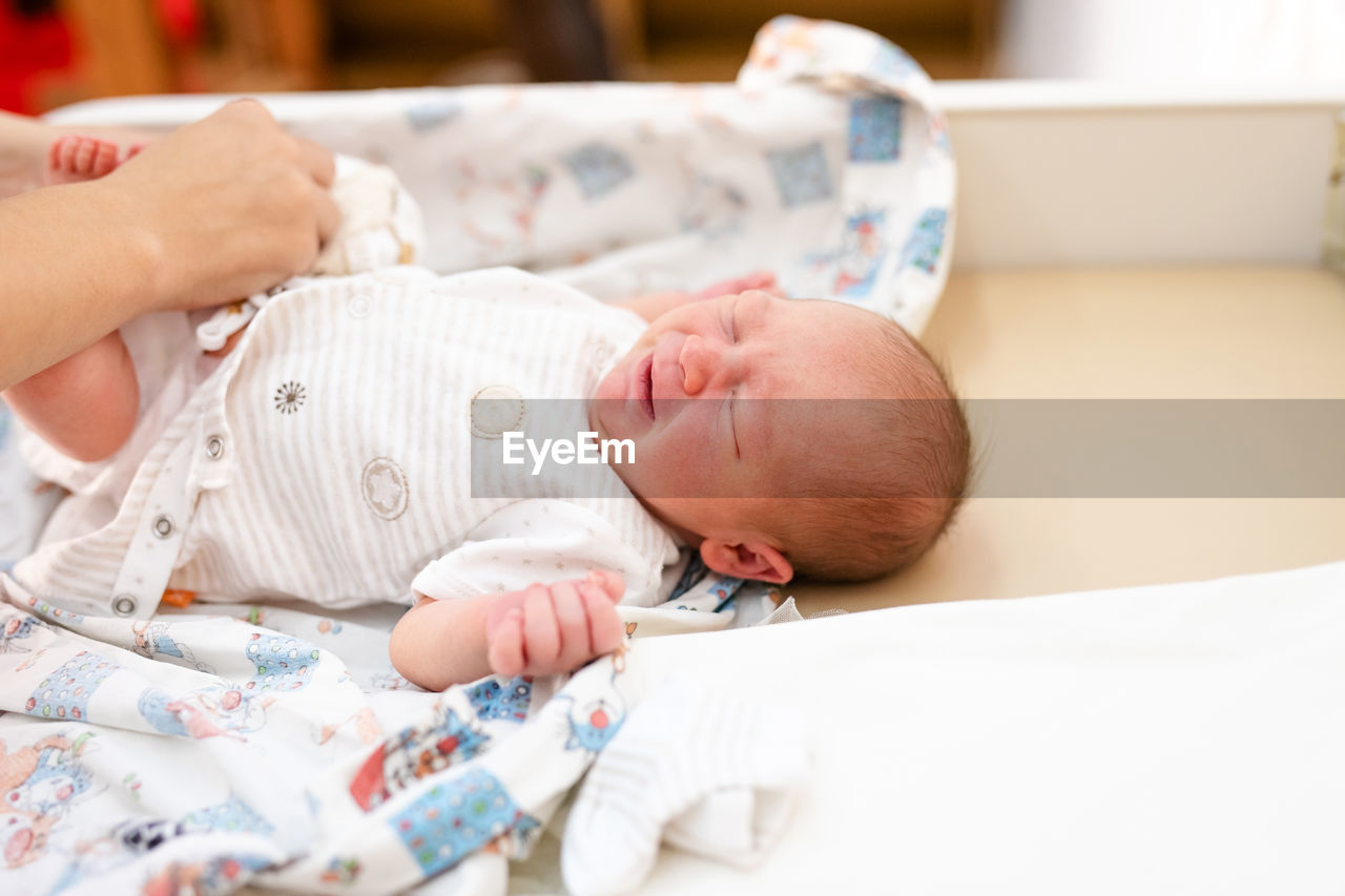 High angle view of cute baby sleeping