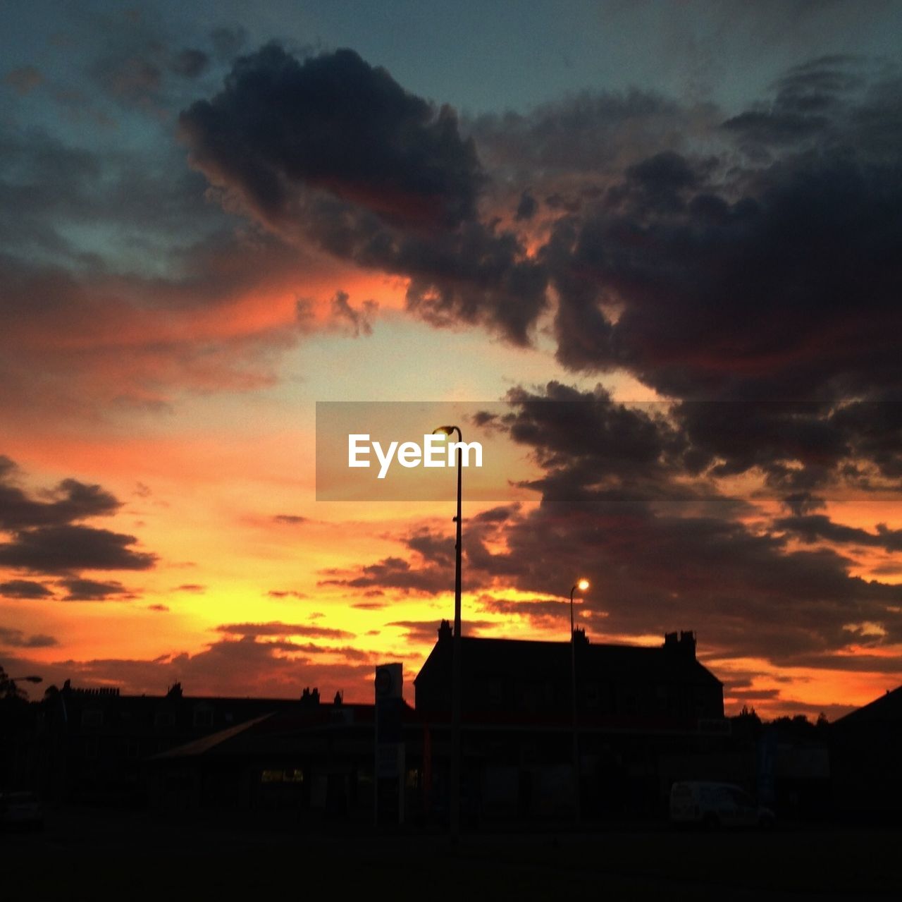 Silhouette building against sky at sunset