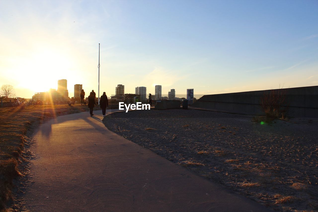 VIEW OF BUILDINGS AT SUNSET