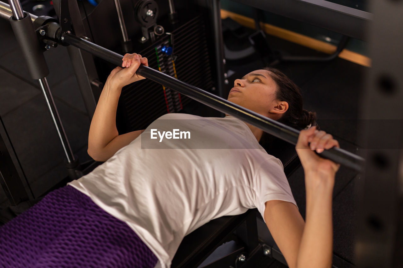 low section of woman exercising in gym